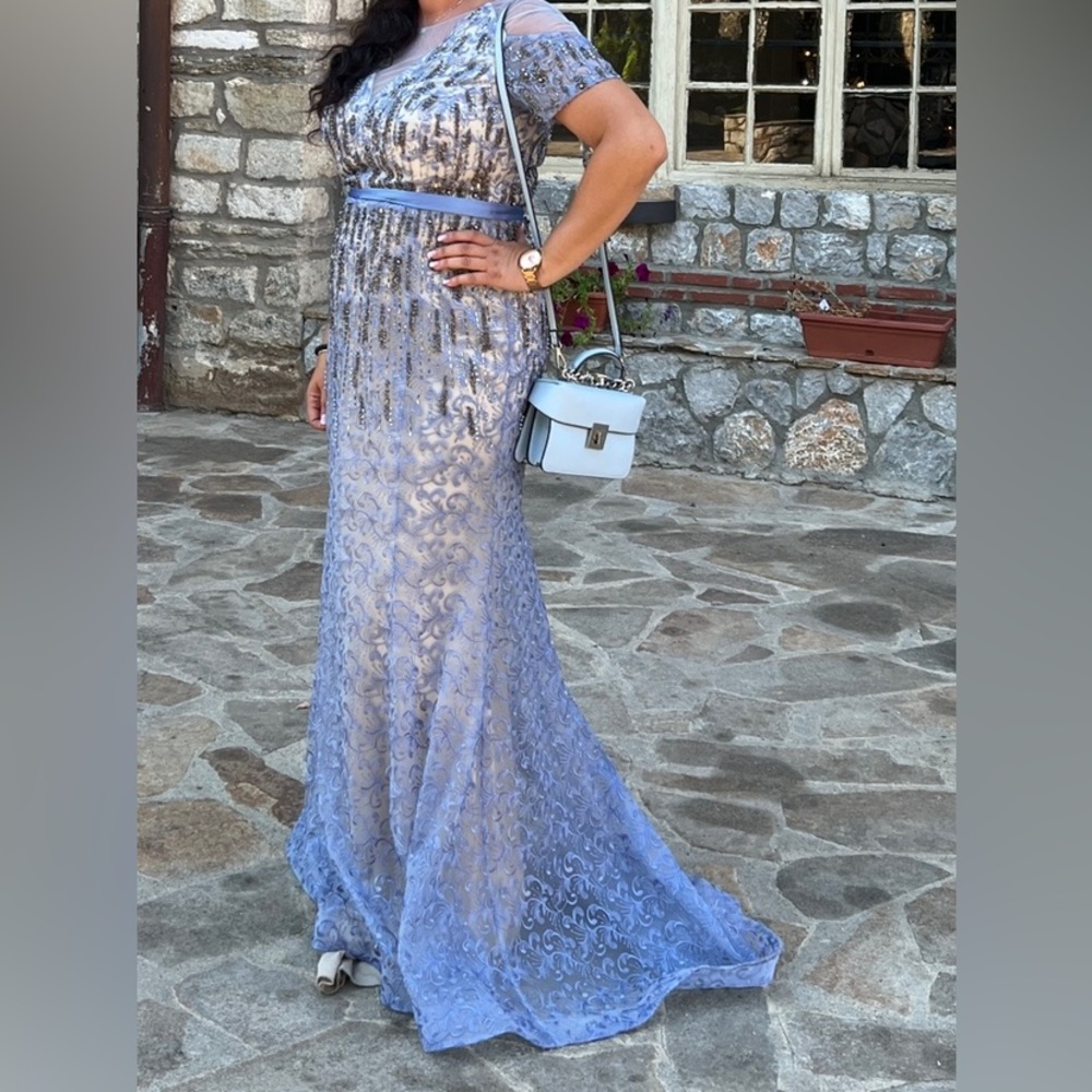 This beautiful dress was bought in Europe and worn once for a wedding